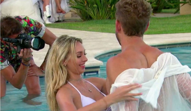 Corinne-taking-Nick-Vialls-Shirt-off-on-The-bachelor-670x388